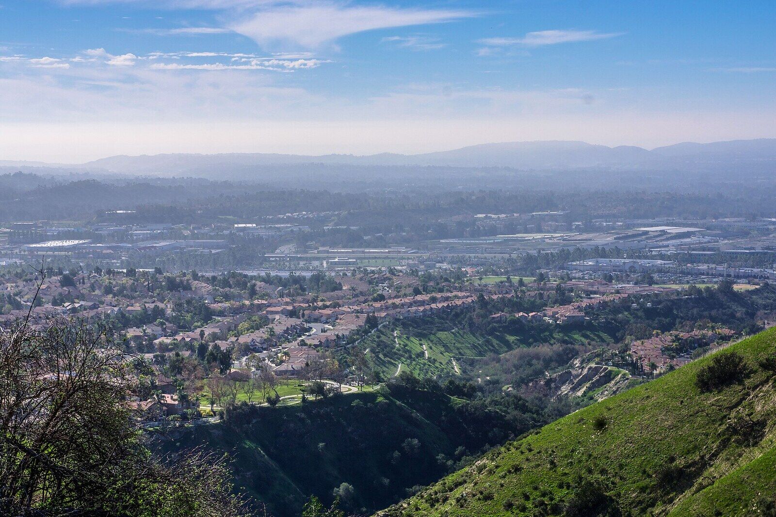 Green hillsides above Foothill Ranch looking out over rooftops and the Saddleback Valley