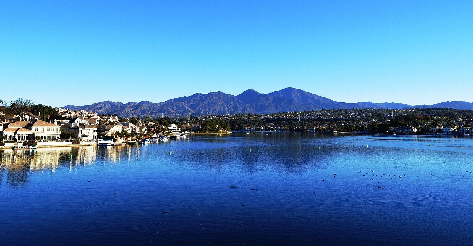 Lake Mission Viejo with lakeside homes and Saddleback on the horizon