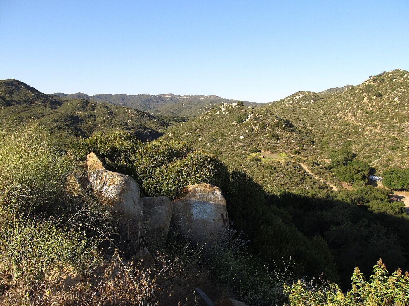 Chaparral-covered slopes and granite boulders along the Ortega Highway in the Santa Ana Mountains