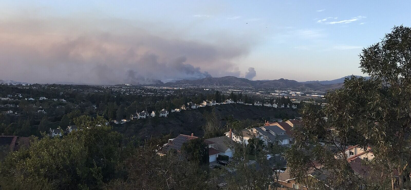 Smoke from the 2020 Silverado Fire drifting over the Saddleback Valley, seen above rooftops in Mission Viejo