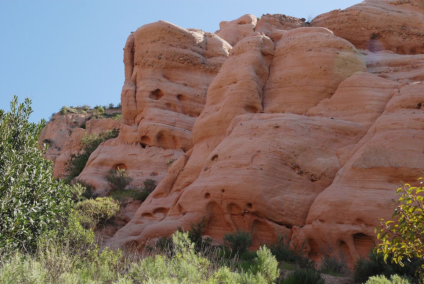 Eroded red sandstone cliffs at Red Rock Canyon in Whiting Ranch Wilderness Park