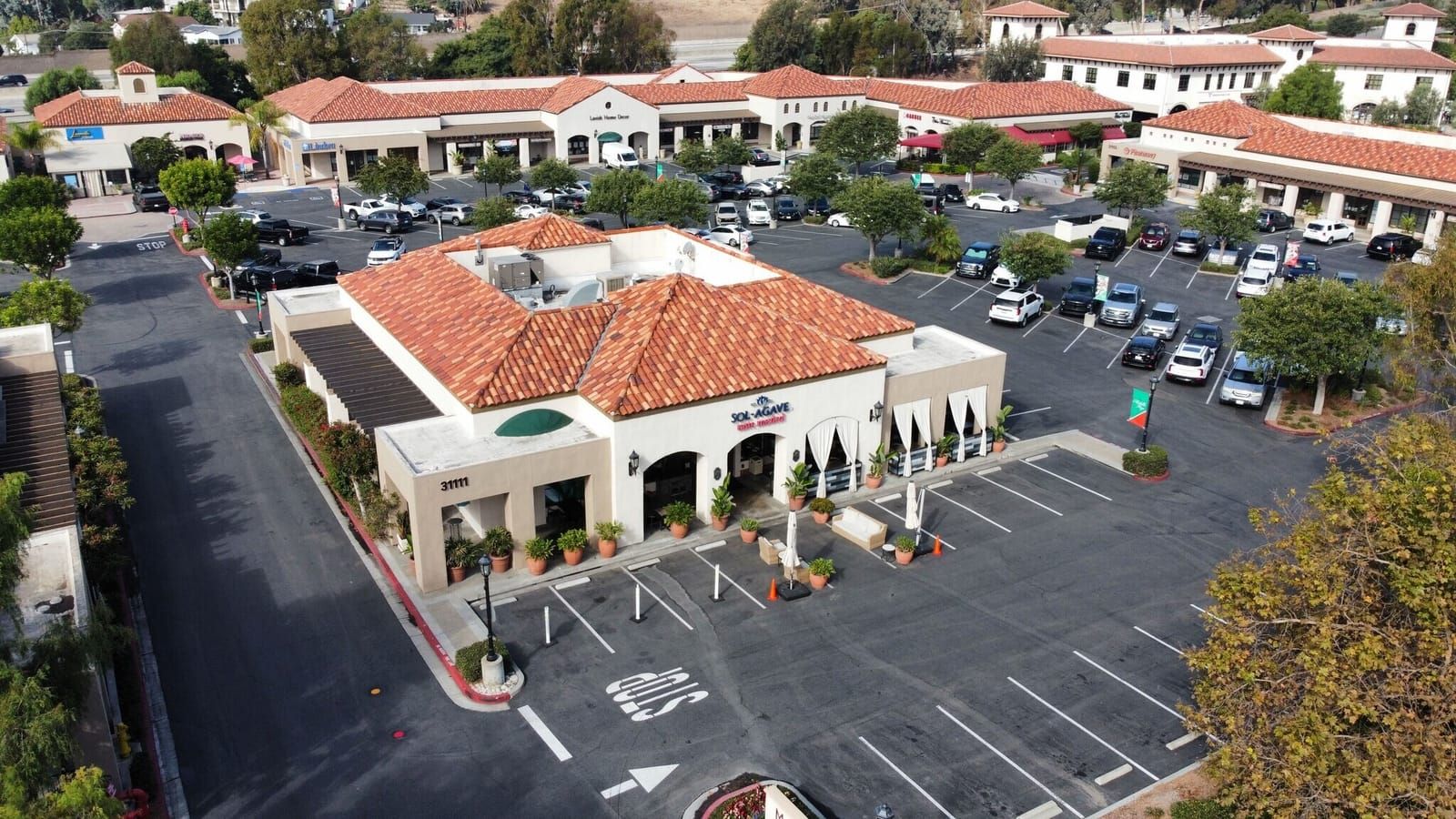 Marbella Plaza courtyard with tile roofs and outdoor dining